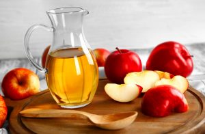 Apple Cider Vinegar With Spoon and Apples